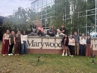 photo of students around marywood campus sign Marywood Student Teachers Gain Experience in Area Schools